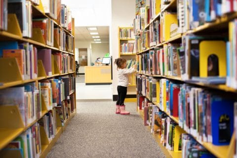 Kids at a library for books