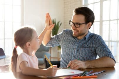 Dad helping daughter with homework